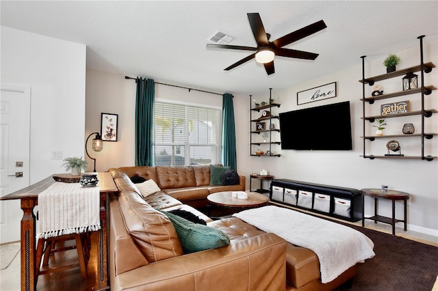 living room featuring ceiling fan