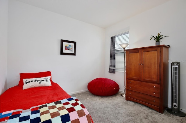 bedroom featuring light carpet