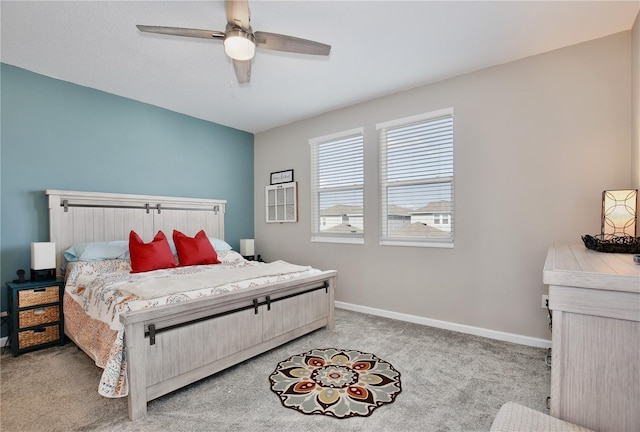 bedroom featuring ceiling fan and light carpet