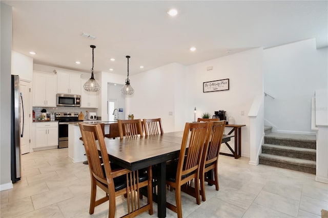 2429 Volunteer Ave, Kissimmee, FL 34744 - dining room featuring stairs, light tile patterned floors, visible vents, and recessed lighting