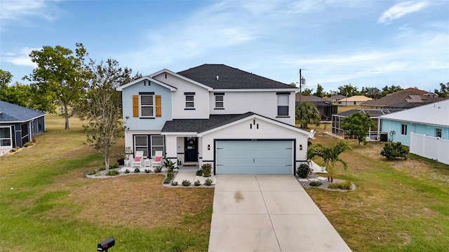 view of front of property with a garage, a porch, and a front yard