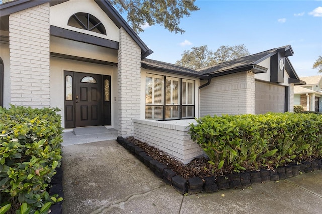 entrance to property featuring a garage