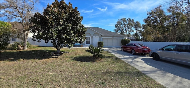 view of front facade with a garage and a front yard