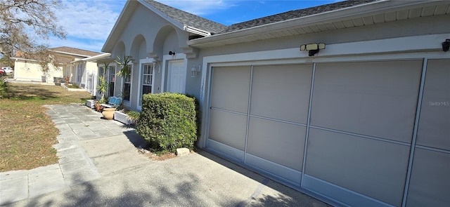 view of property exterior with a garage