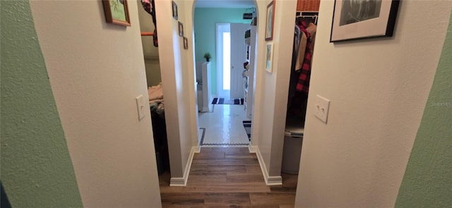 corridor featuring dark wood-type flooring