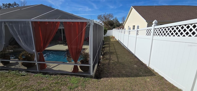 view of home's exterior with a pool