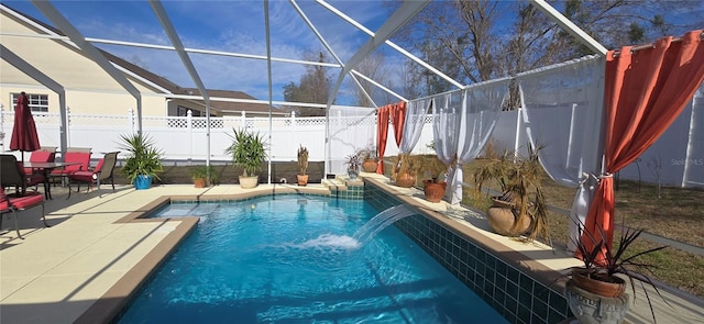 view of pool featuring a patio, a lanai, and pool water feature