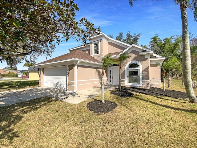 view of front facade with a garage and a front yard