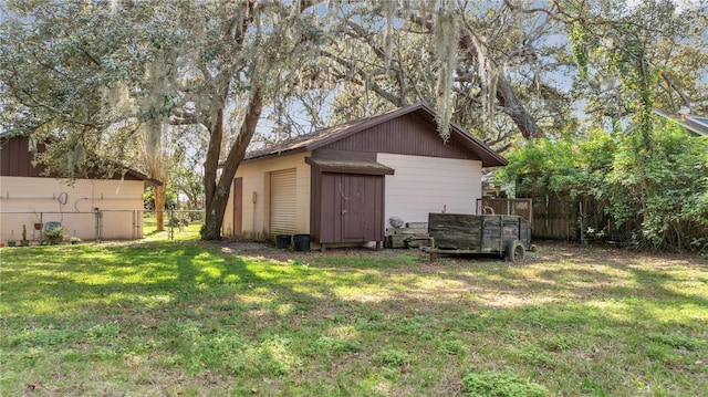 view of shed featuring fence