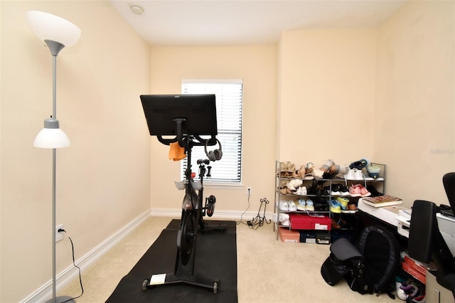 workout area featuring light colored carpet