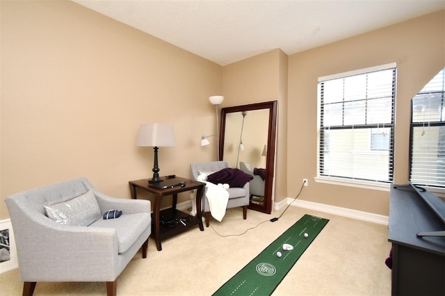 sitting room with light colored carpet