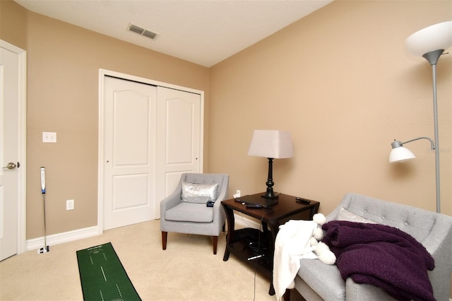 living area with light colored carpet