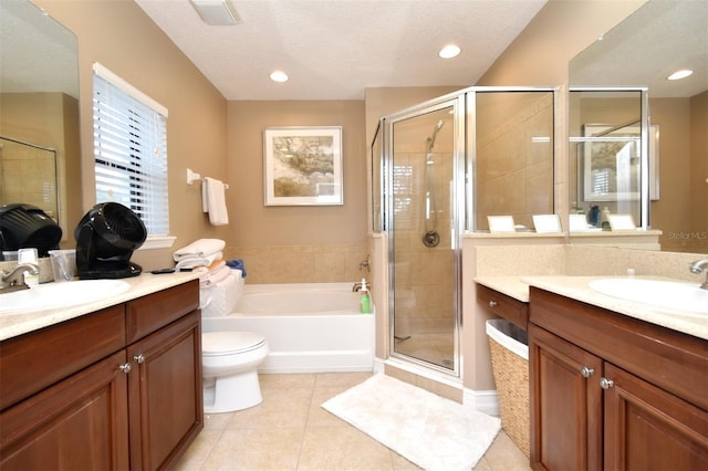 full bathroom with vanity, a textured ceiling, tile patterned floors, independent shower and bath, and toilet