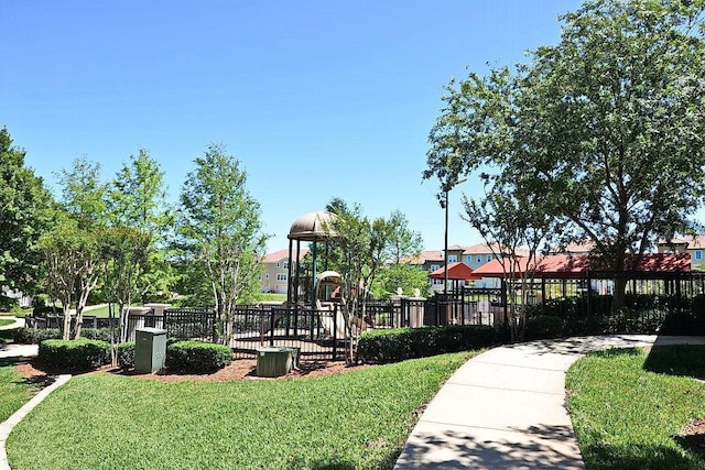 view of playground featuring a lawn