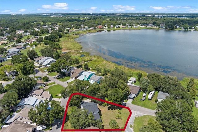 bird's eye view featuring a water view and a residential view