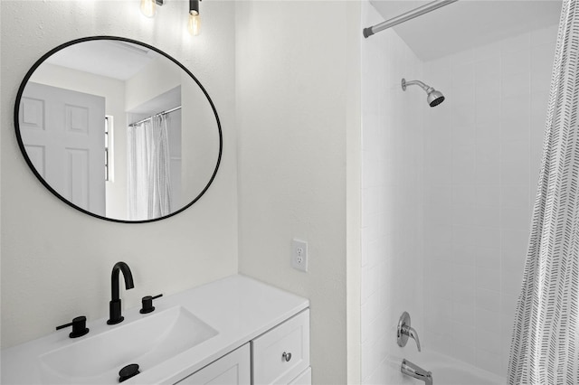 bathroom with shower / tub combo with curtain and vanity