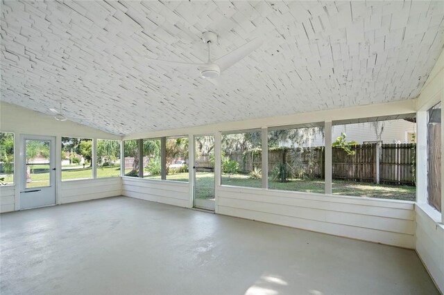 unfurnished sunroom with lofted ceiling and a healthy amount of sunlight