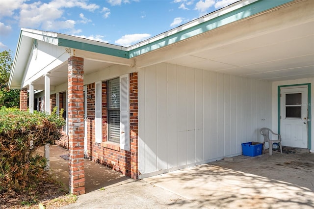 view of side of home featuring brick siding