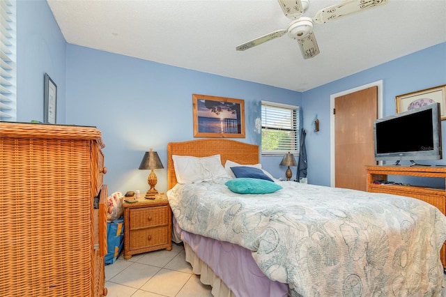 bedroom featuring ceiling fan and light tile patterned flooring