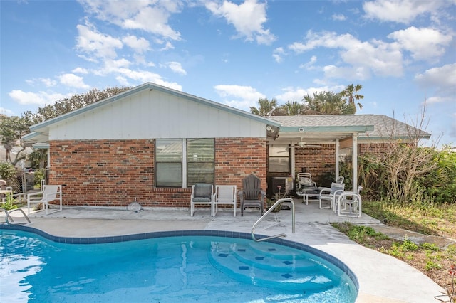 pool featuring ceiling fan and a patio area