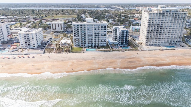 bird's eye view with a water view and a view of the beach