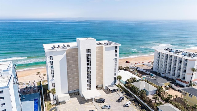 drone / aerial view with a view of the beach and a water view