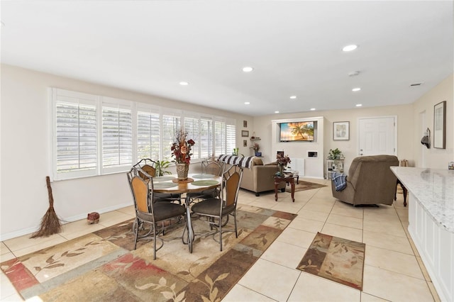 dining area featuring light tile patterned floors