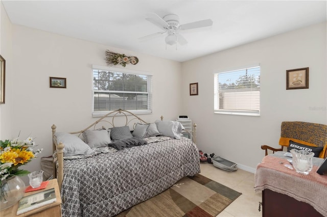 tiled bedroom with ceiling fan