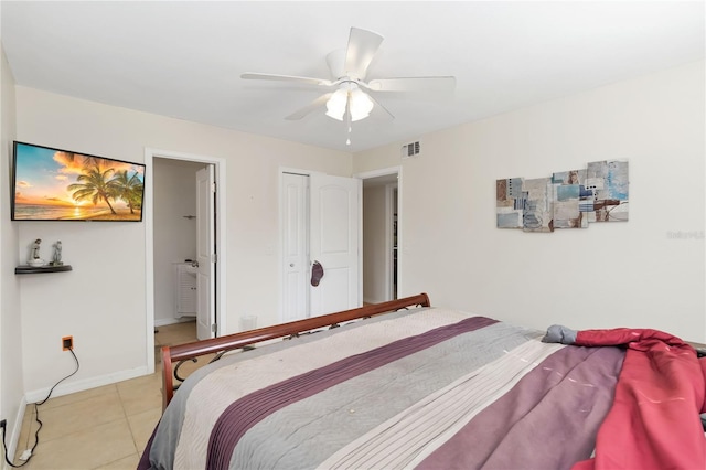 tiled bedroom featuring a closet and ceiling fan