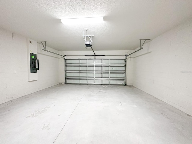 garage featuring a garage door opener and electric panel