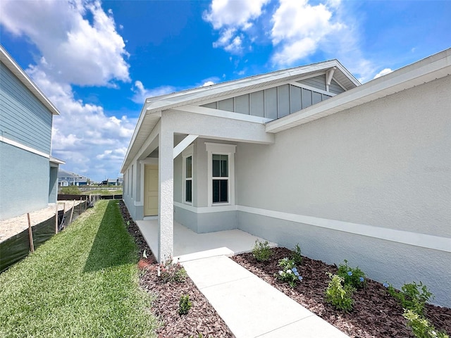 entrance to property with a yard