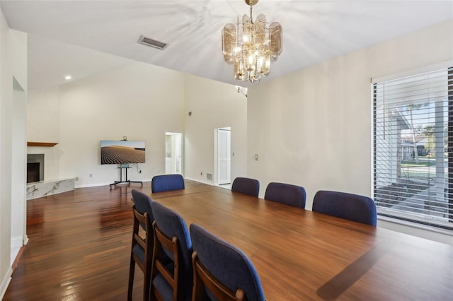 124 Loon Ct, Daytona Beach, FL 32119 - dining space with a chandelier, wood finished floors, and a premium fireplace