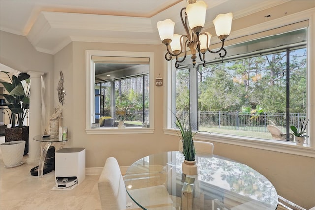 dining area with baseboards, a chandelier, and ornamental molding