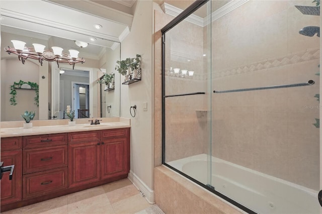 full bathroom with tiled shower / bath, ornamental molding, vanity, baseboards, and tile patterned floors