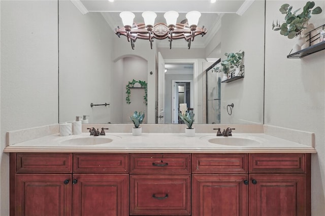 bathroom featuring crown molding, a sink, and double vanity