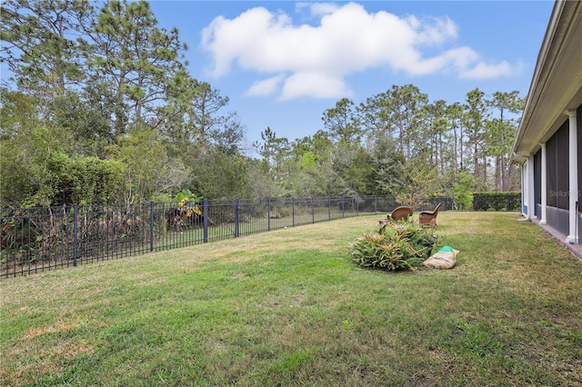 view of yard with a fenced backyard and a playground