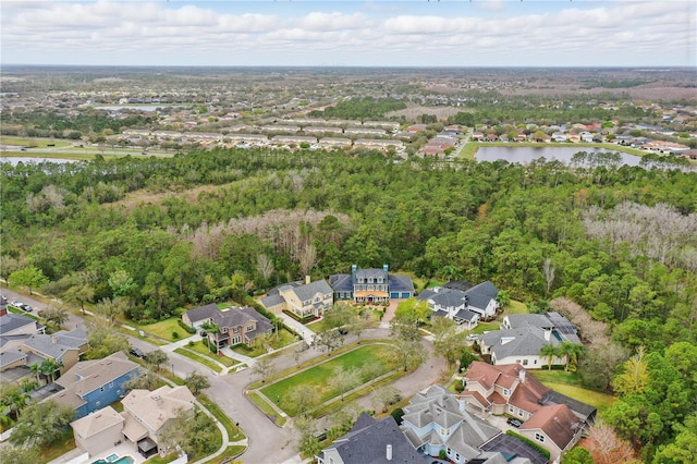 drone / aerial view featuring a water view and a residential view