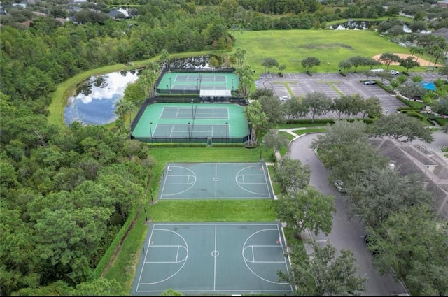 birds eye view of property with a water view