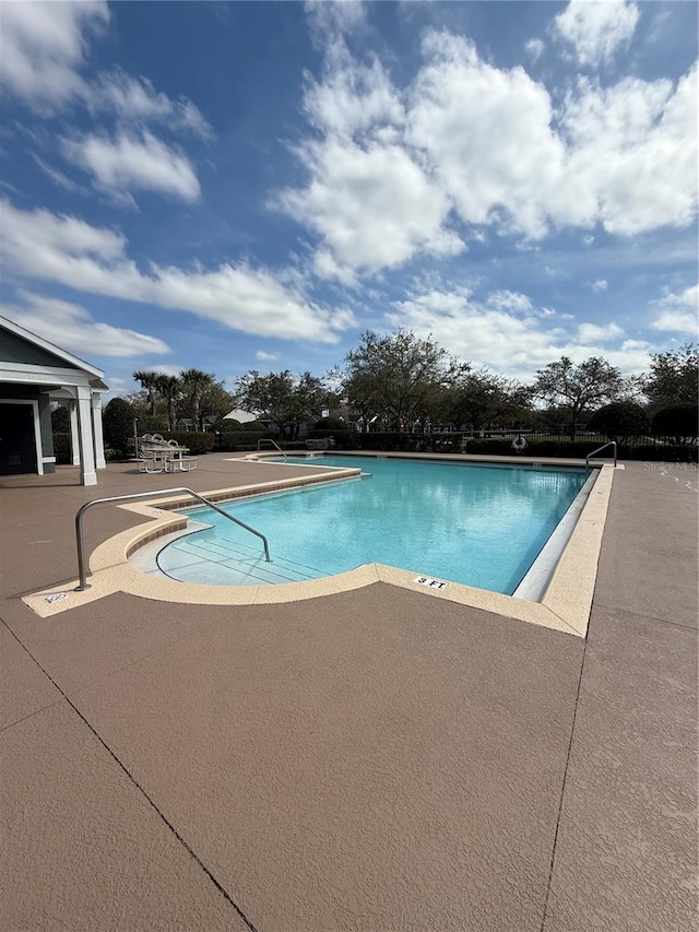 pool with a patio area