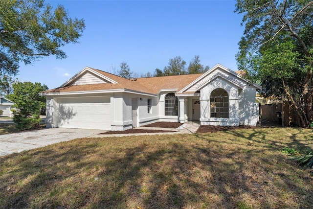 ranch-style home with a garage and a front lawn