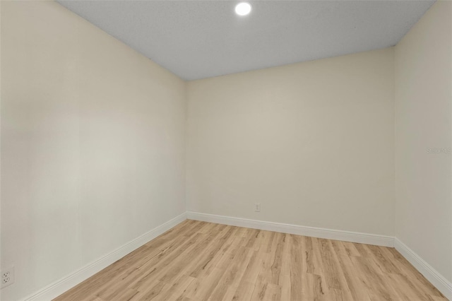 unfurnished room featuring light wood-type flooring