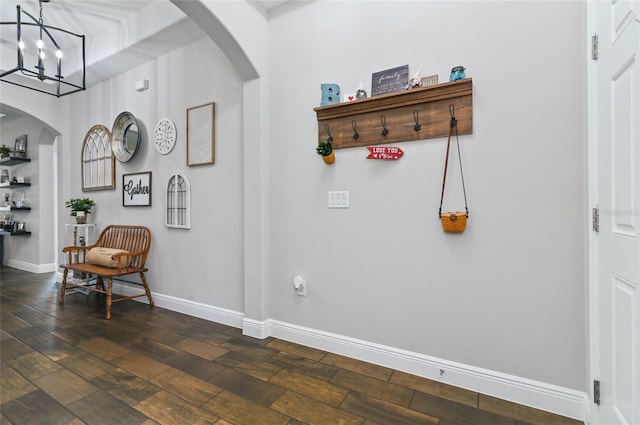 foyer featuring dark hardwood / wood-style floors and a notable chandelier