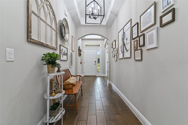 entryway featuring a notable chandelier