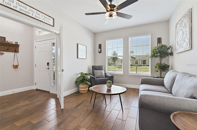 interior space with dark wood-type flooring and ceiling fan