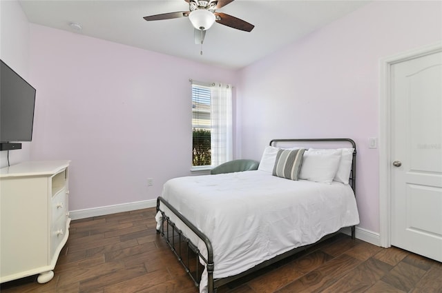 bedroom featuring dark wood-type flooring and ceiling fan