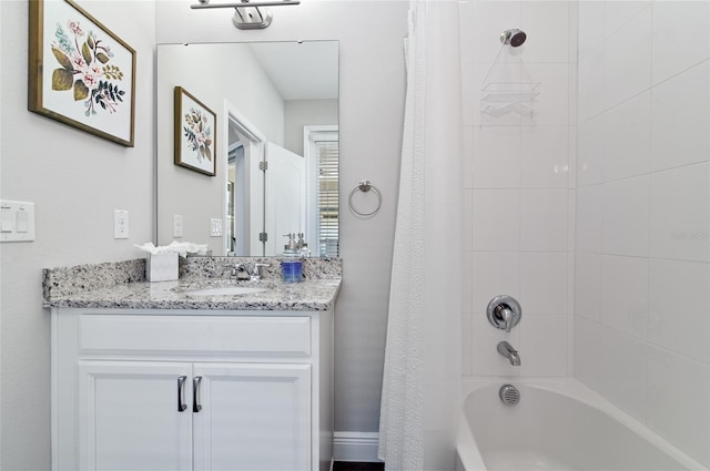 bathroom with vanity and tiled shower / bath