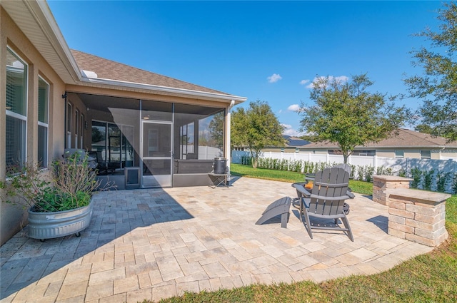 view of patio / terrace featuring a sunroom