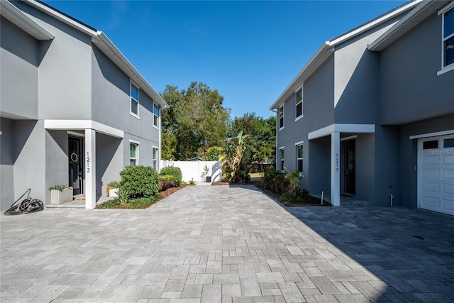 view of side of home featuring a garage