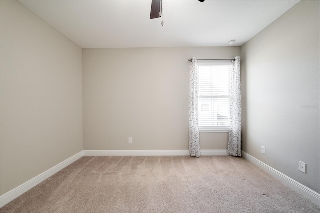 unfurnished room with light carpet and ceiling fan