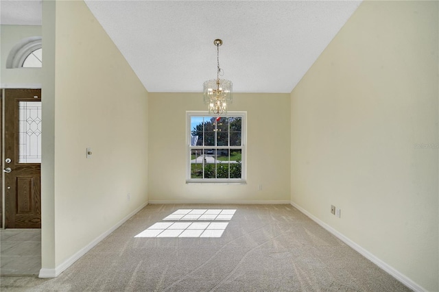 unfurnished dining area featuring an inviting chandelier, light colored carpet, lofted ceiling, and a textured ceiling